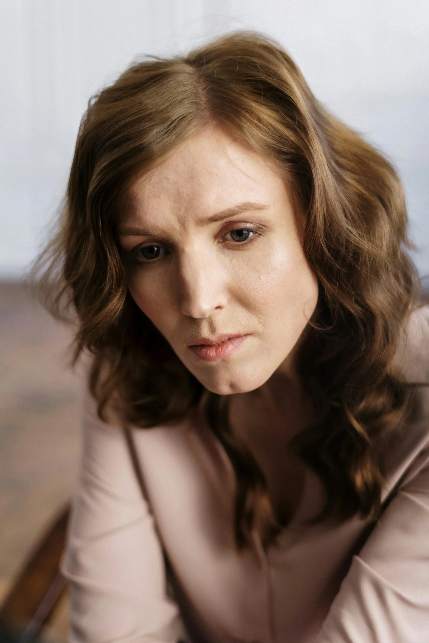 Unhappy woman at a divorce hearing.