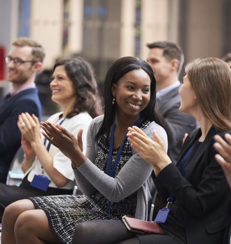 Audience Applauding Speaker After Conference Presentation